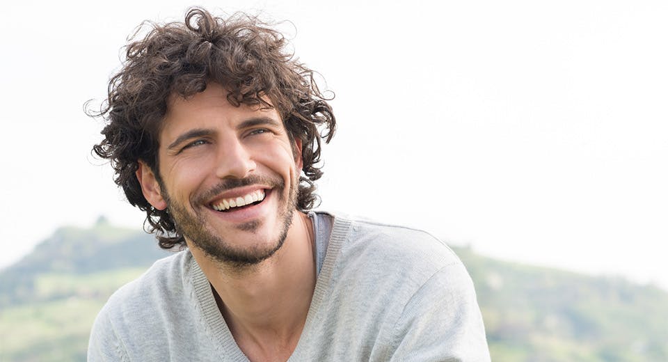 man smiling outside