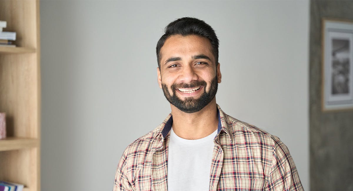 man in flannel smiling