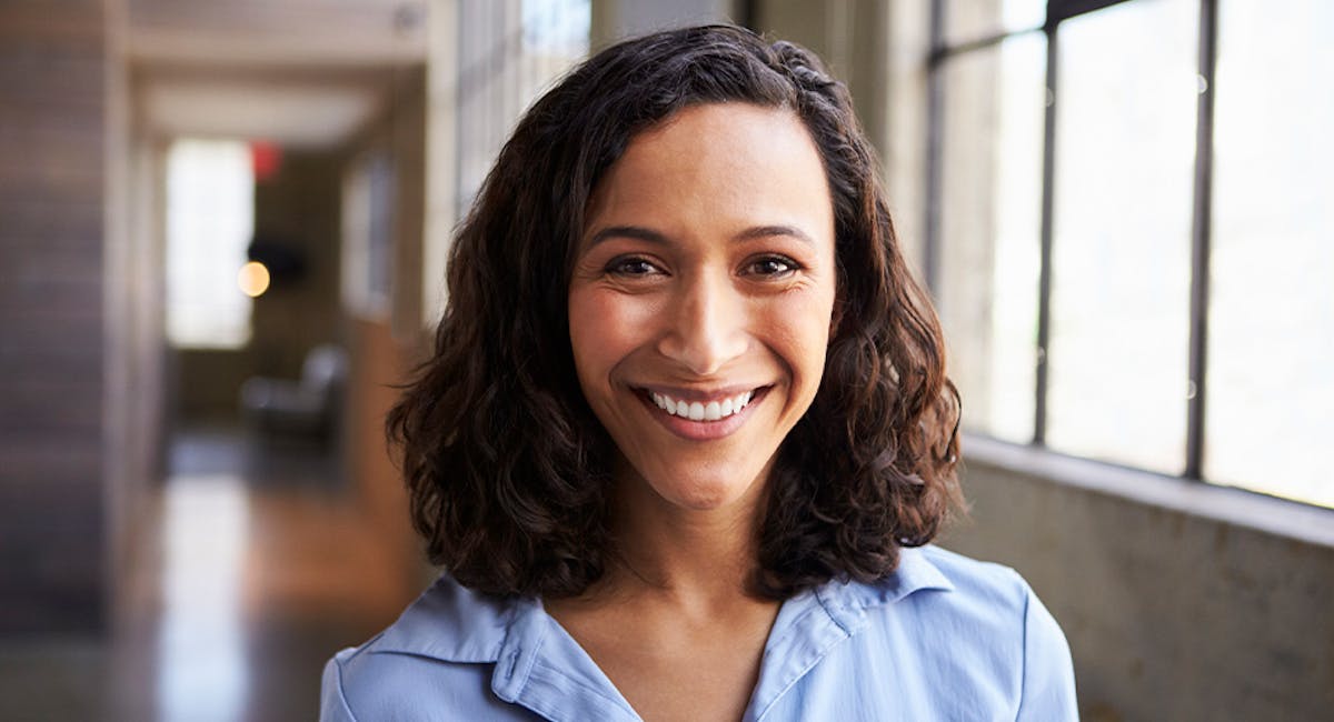 woman smiling in hallway