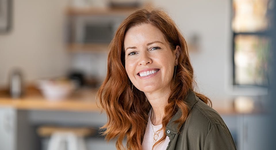 woman smiling in kitchen