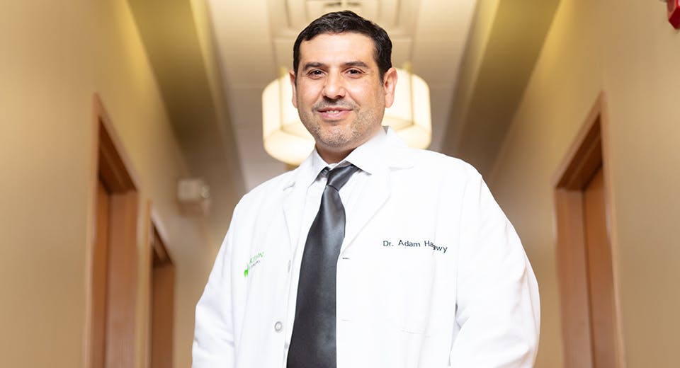Dr Hamawy standing at front desk