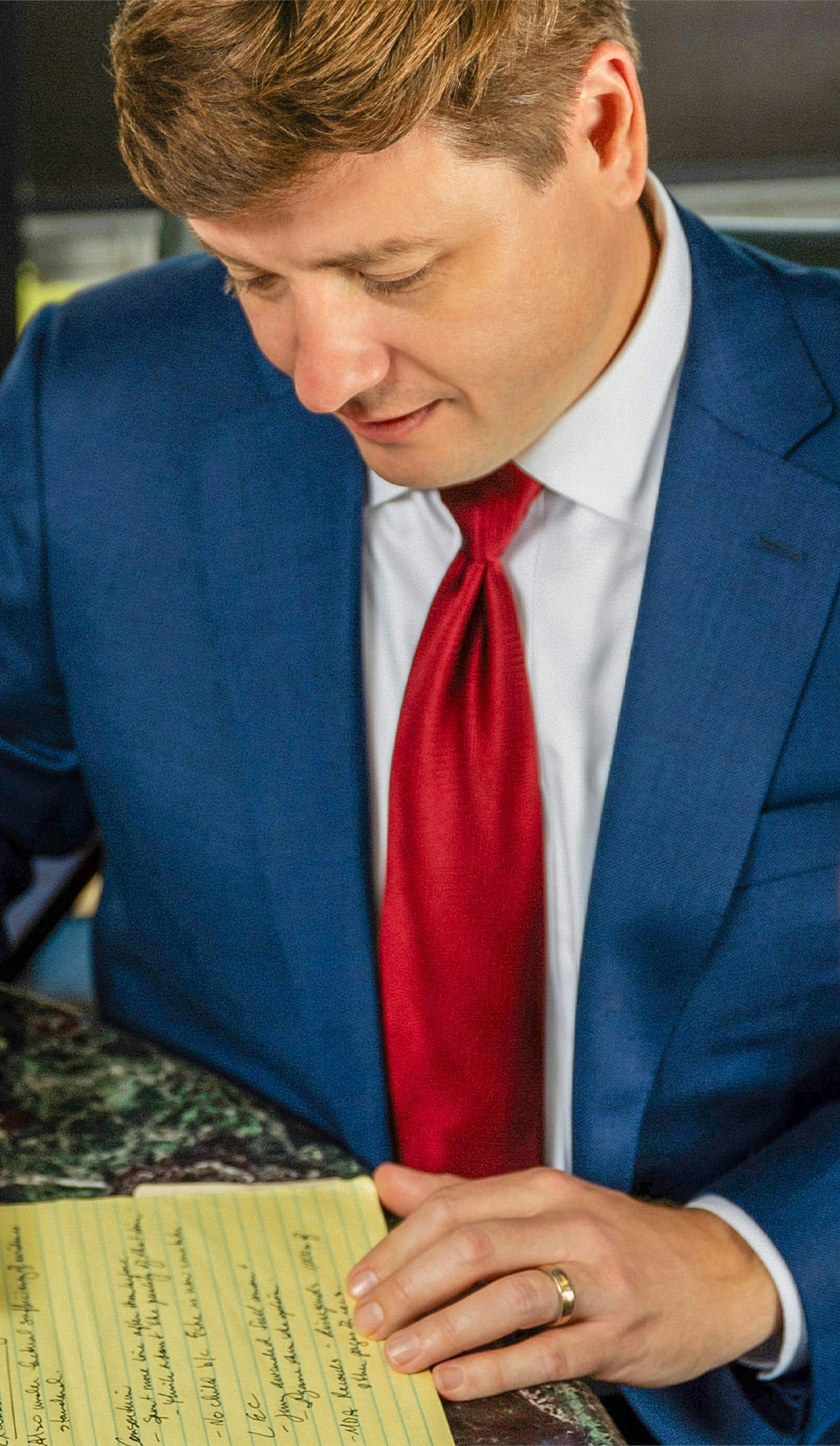 man reading from legal pad