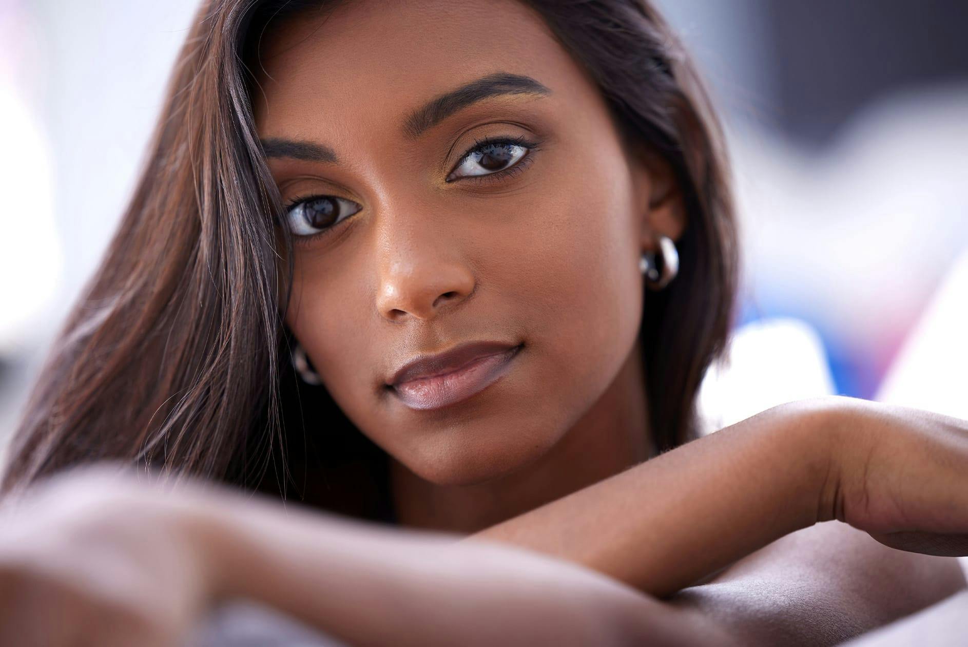 Dark-skinned woman with earrings