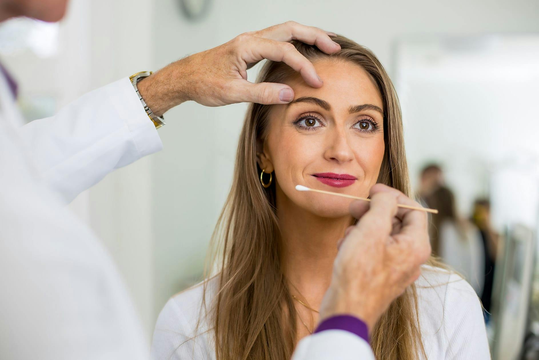 Woman receiving skincare treatment