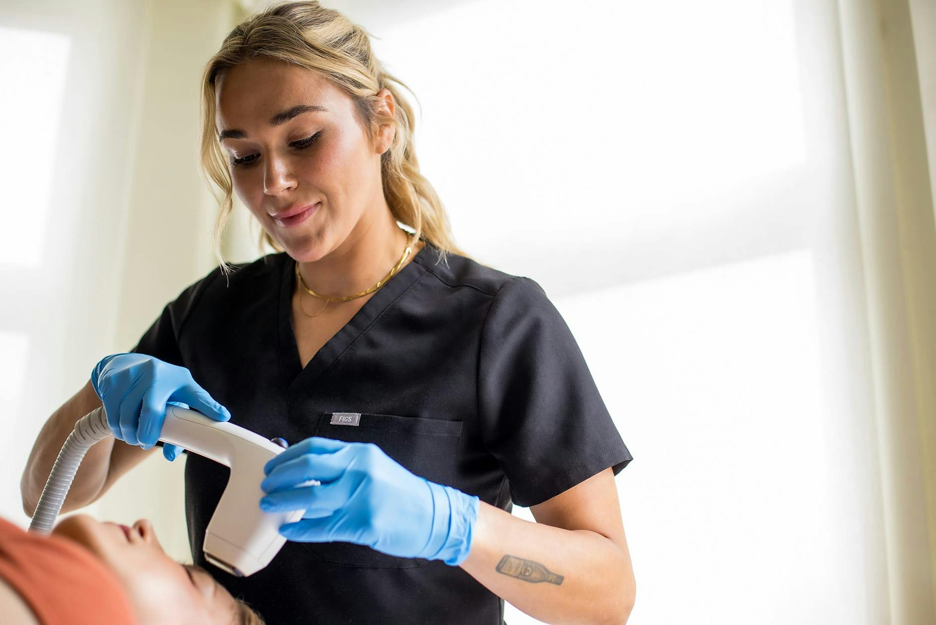 Sydney performing laser treatment