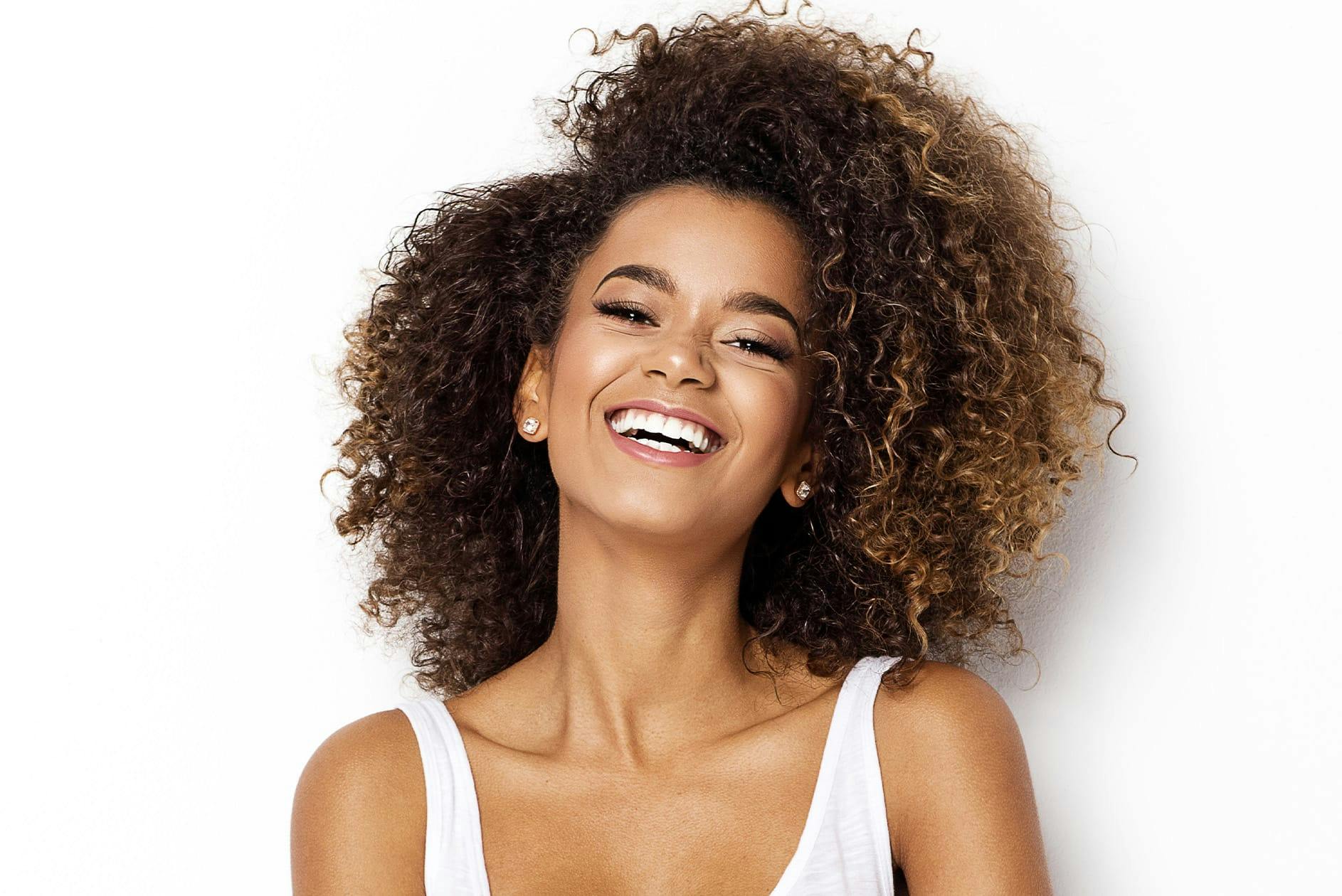 Curly-haired woman smiling