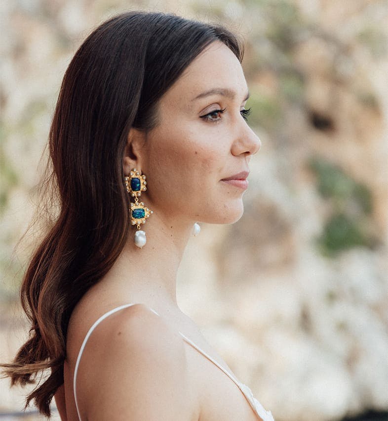 Brunette wearing dangling earrings