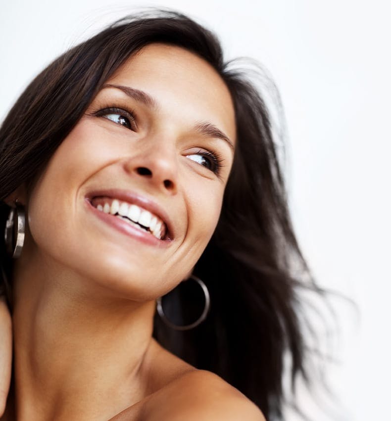 smiling woman with hoop earrings