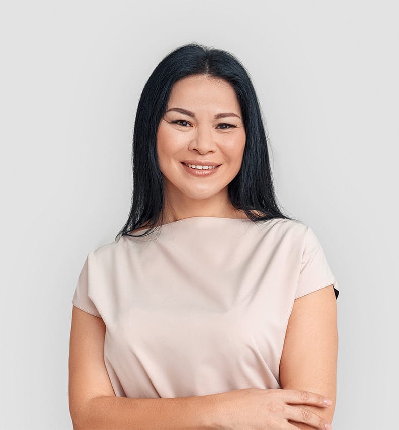 asian woman smiling at camera