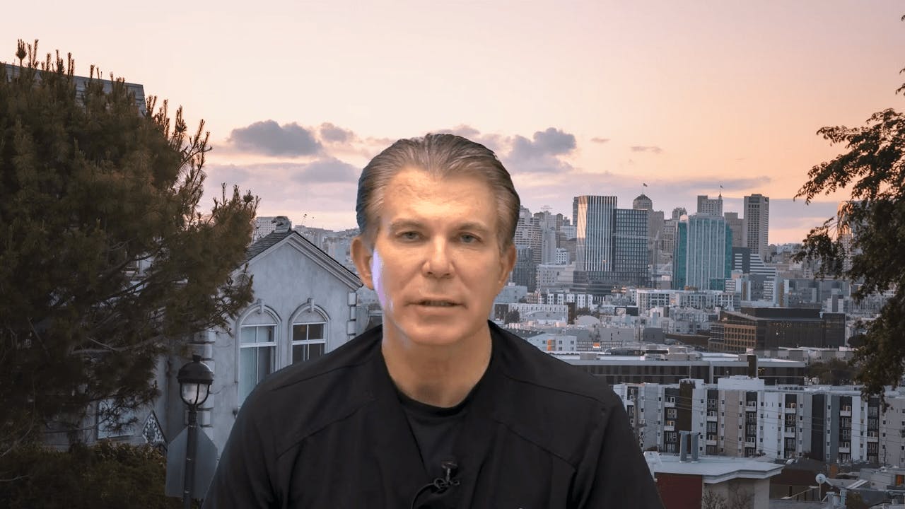 dr maas in front of a background of a city