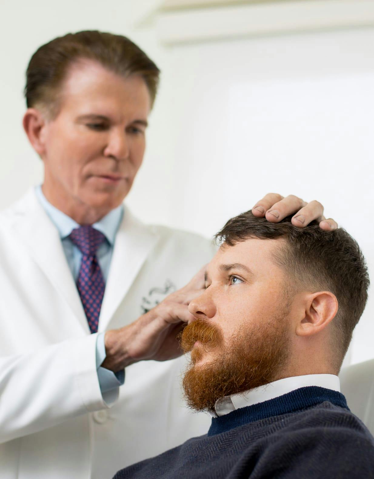 Dr mass touching a man's head