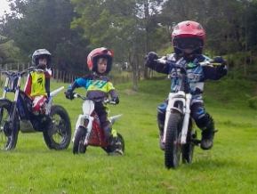 Three junior riders on trials bikes