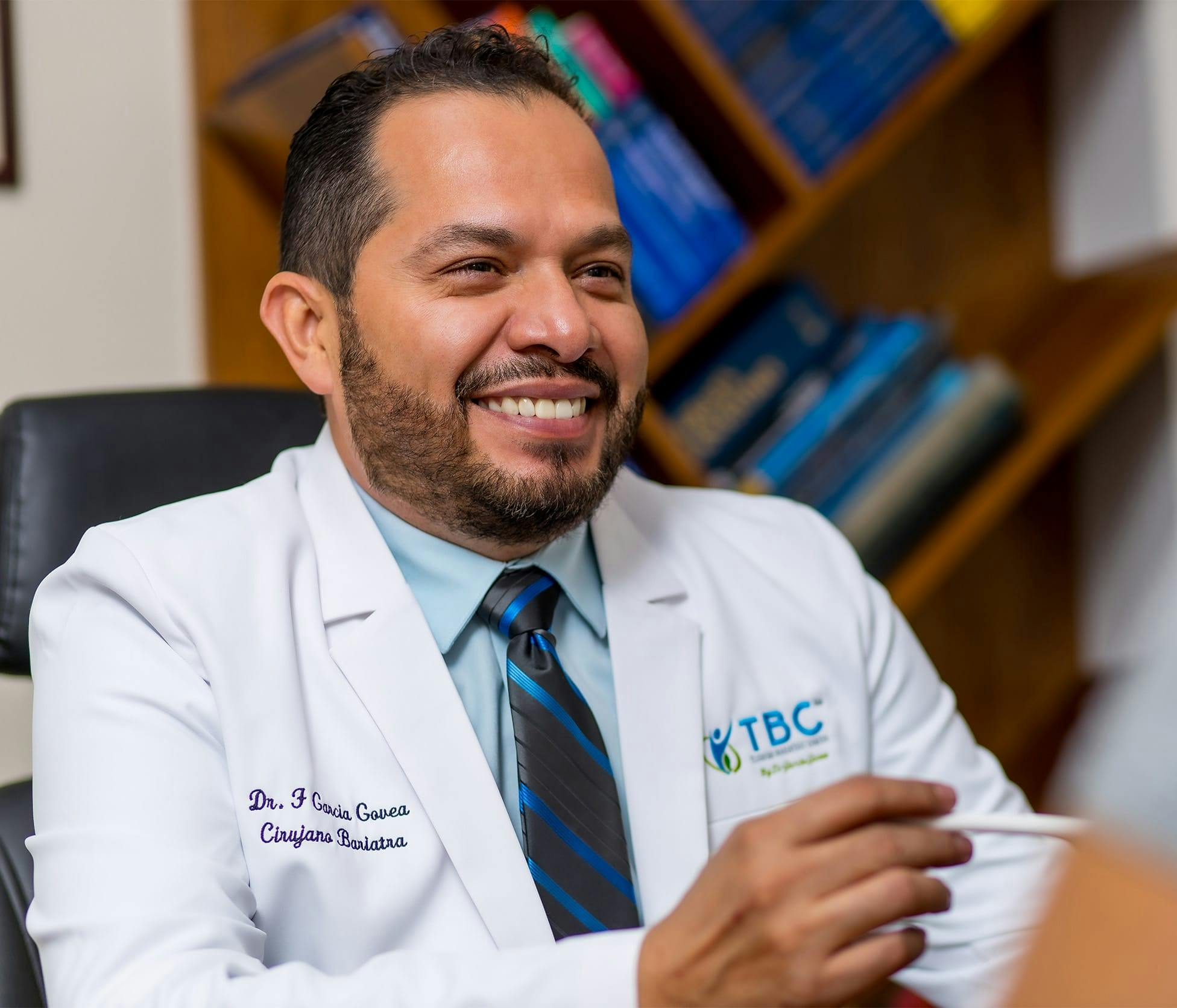 Dr. Fernando Garcia Govea Smiling and speaking with patient