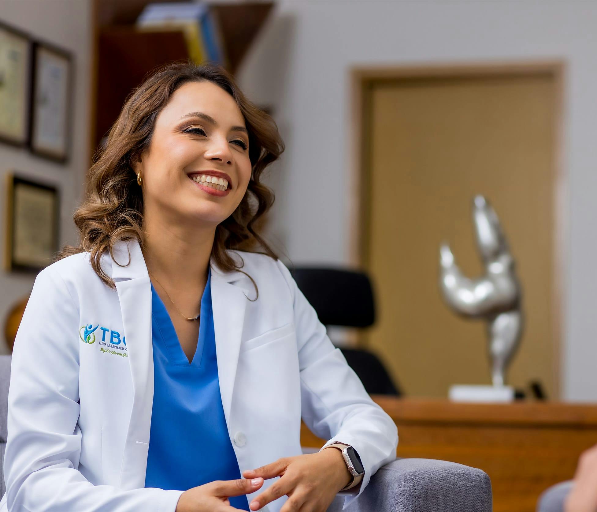 Dr. Marcela Olague smiling and sitting in her office