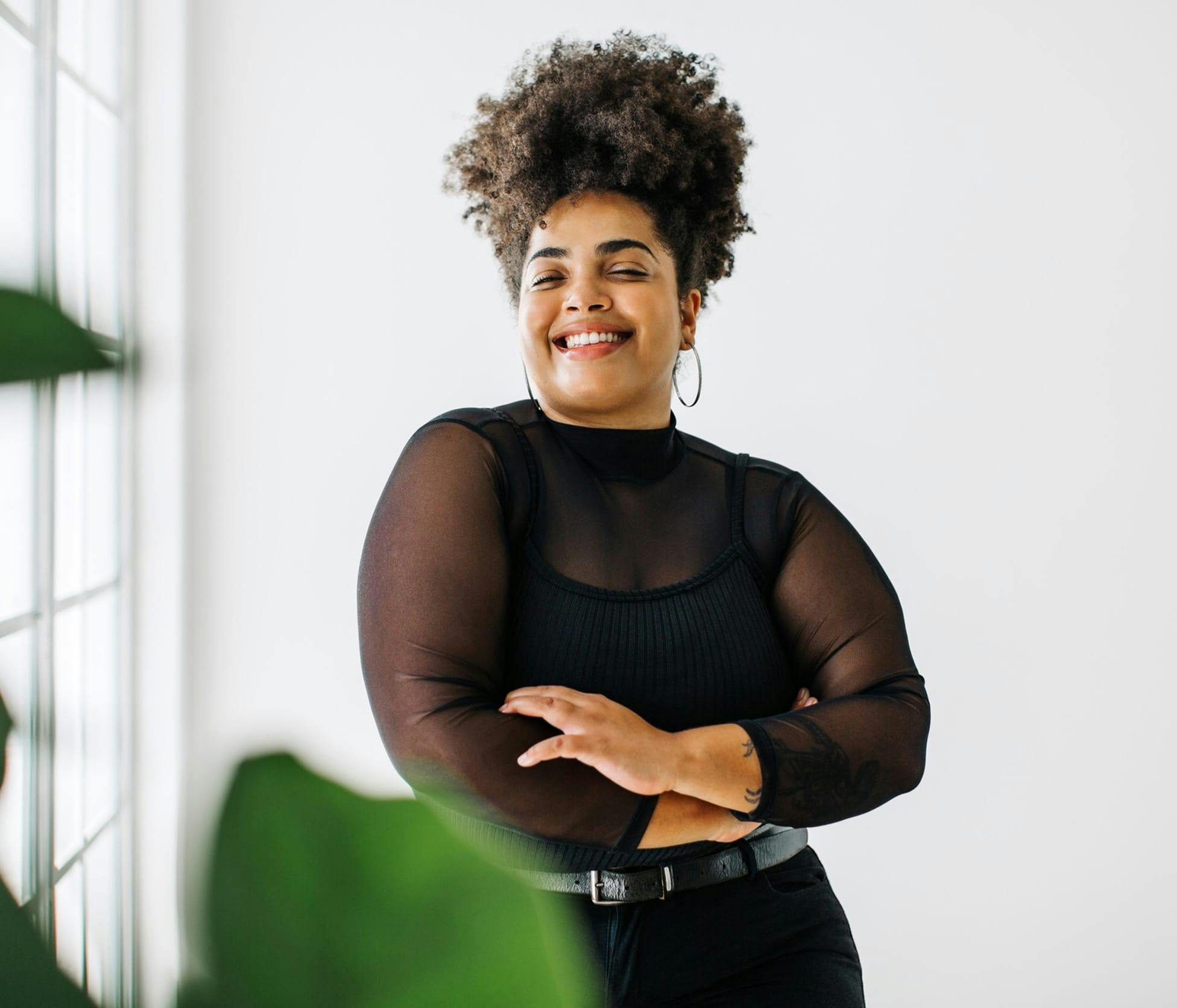 Woman smiling with arms crossed