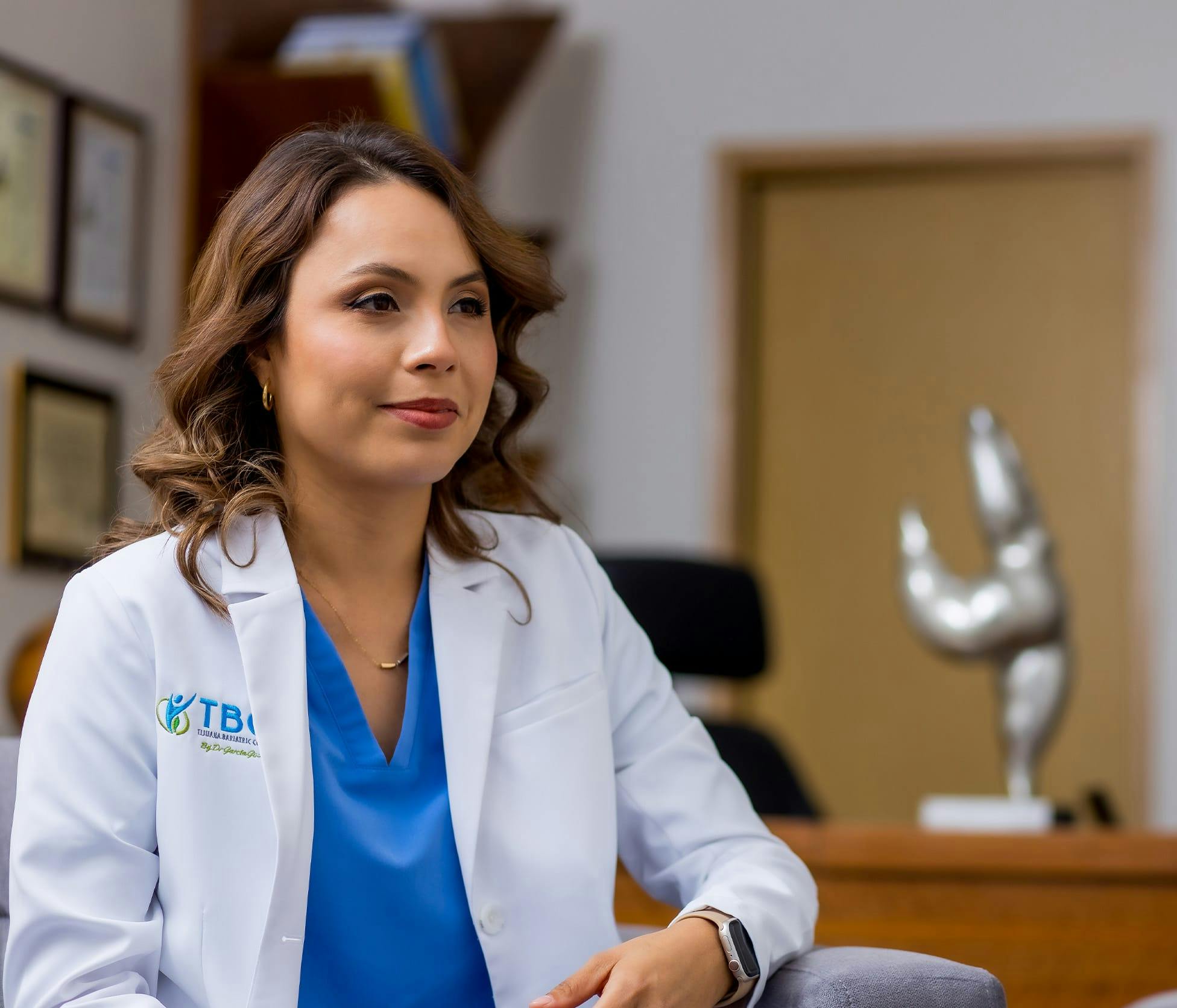 Dr. Marcela Olague sitting in her office smiling