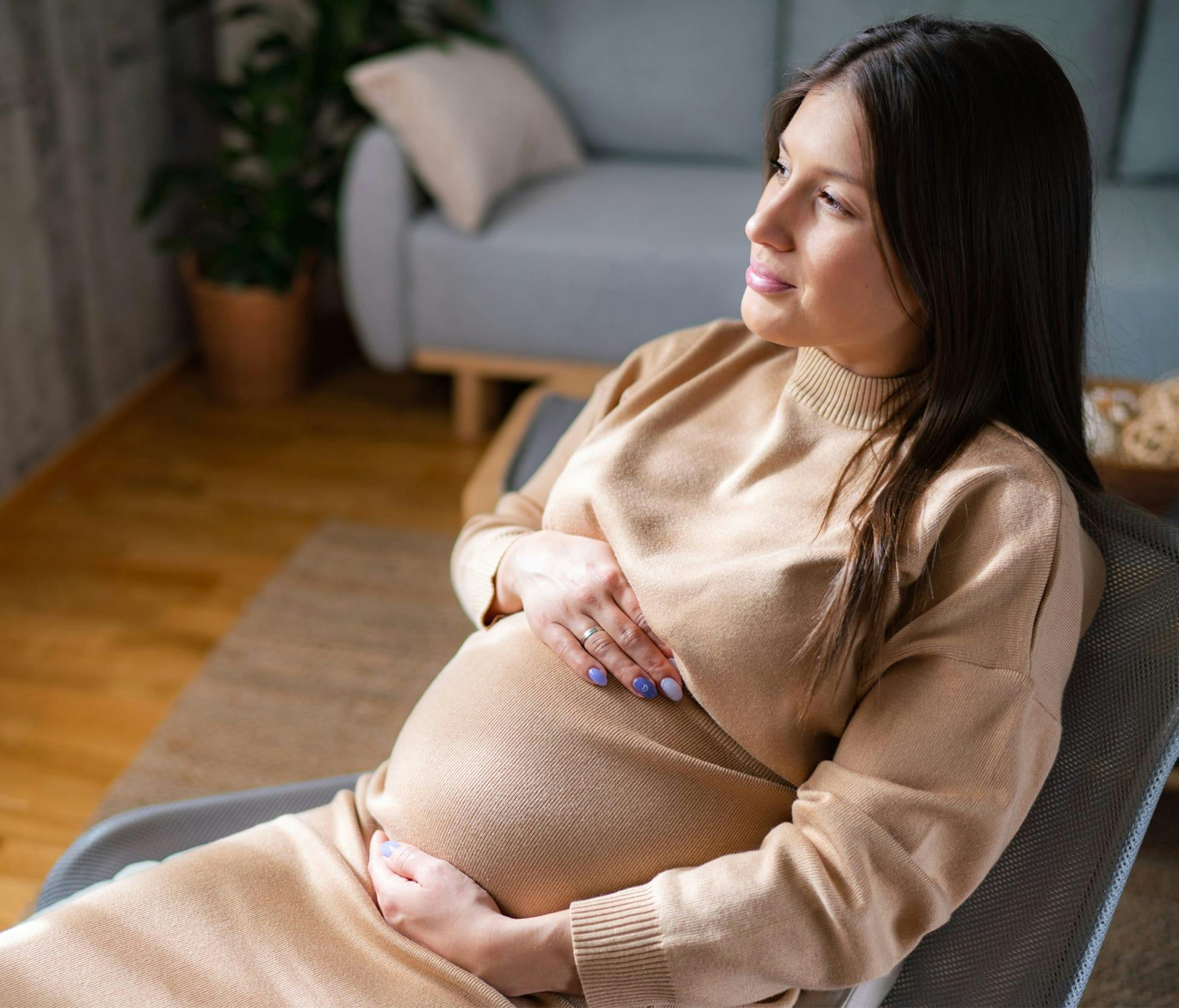 Pregnant woman sitting in chair