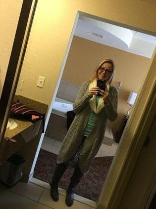 lady in mirror after weight loss surgery