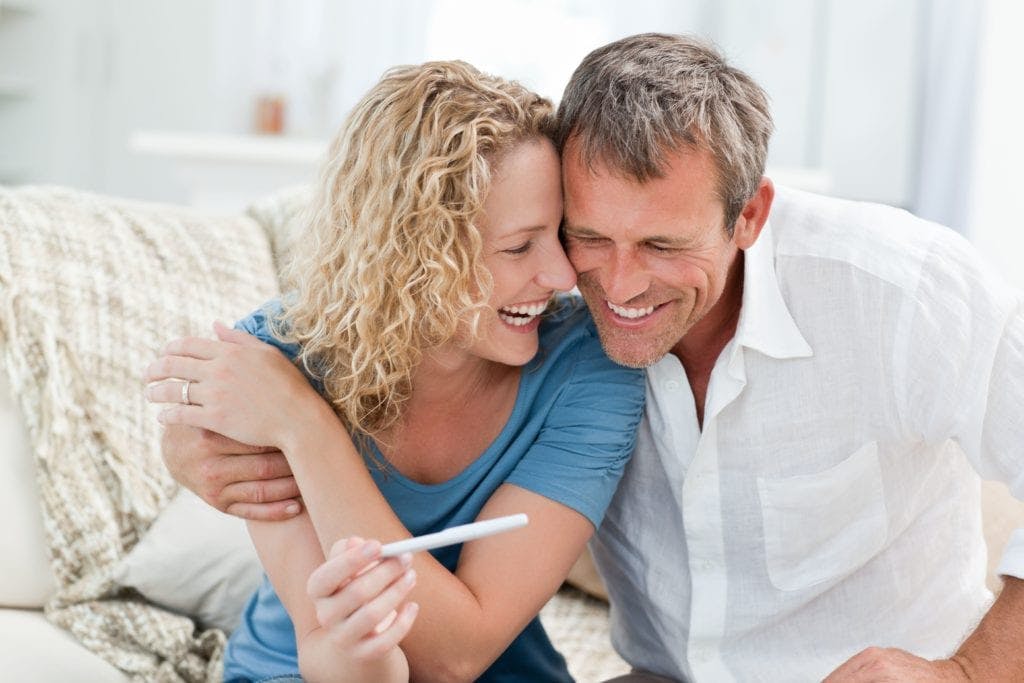 couple looking at pregnancy test