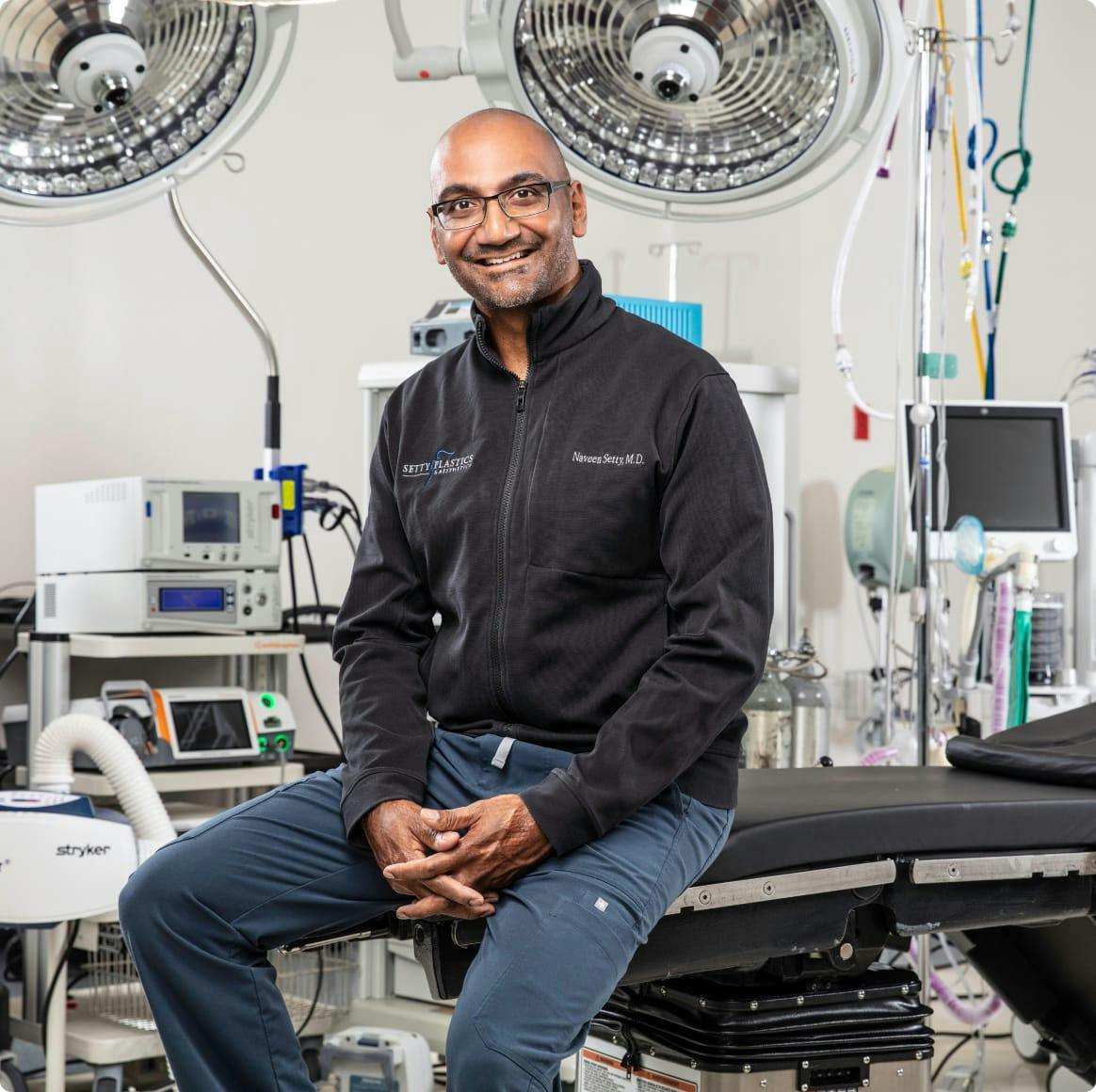 Dr. Setty in a suit, sitting down