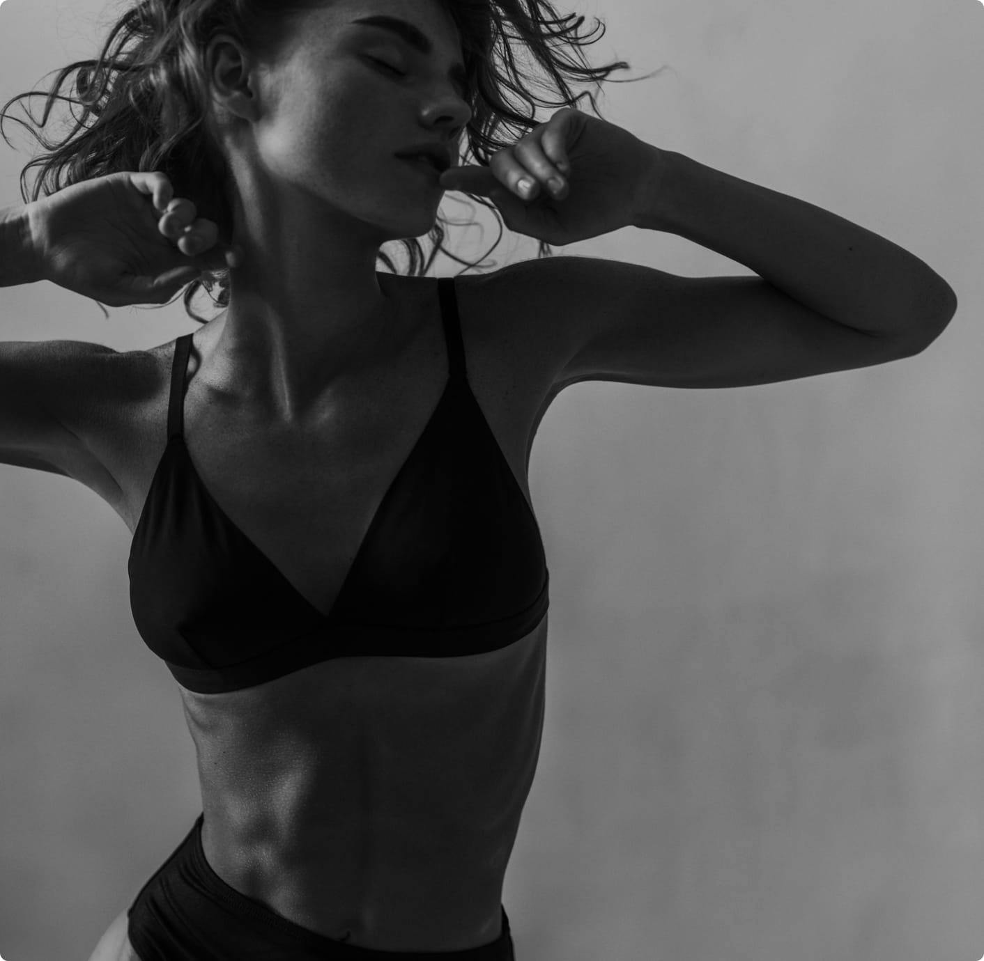 black and white image of woman in undergarments