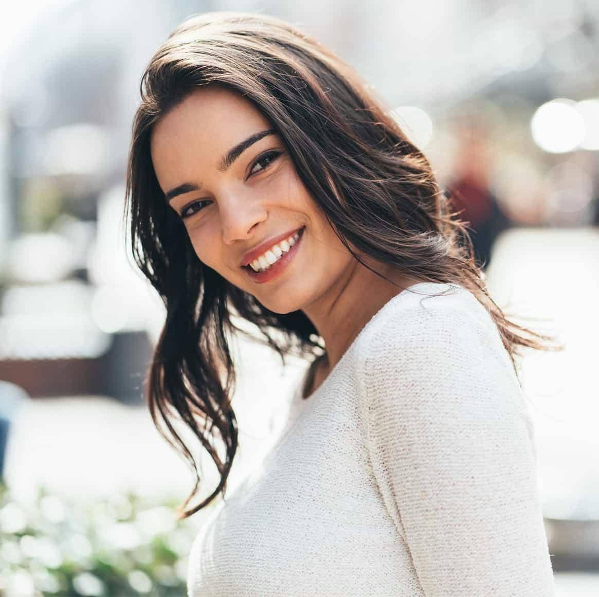 woman with brown hair smiling