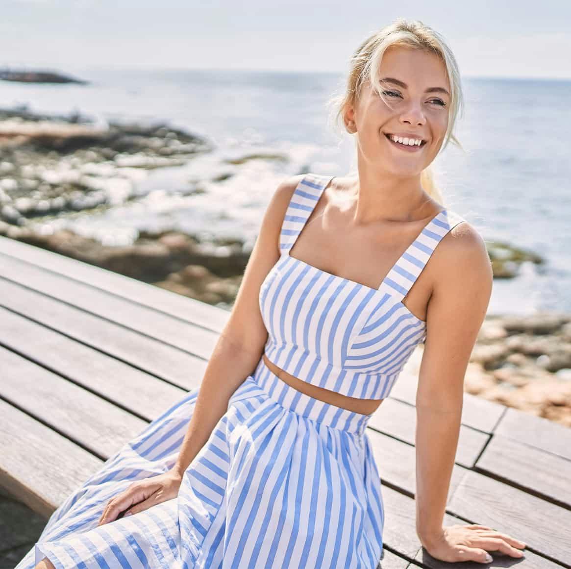 woman in blue and white striped outfit