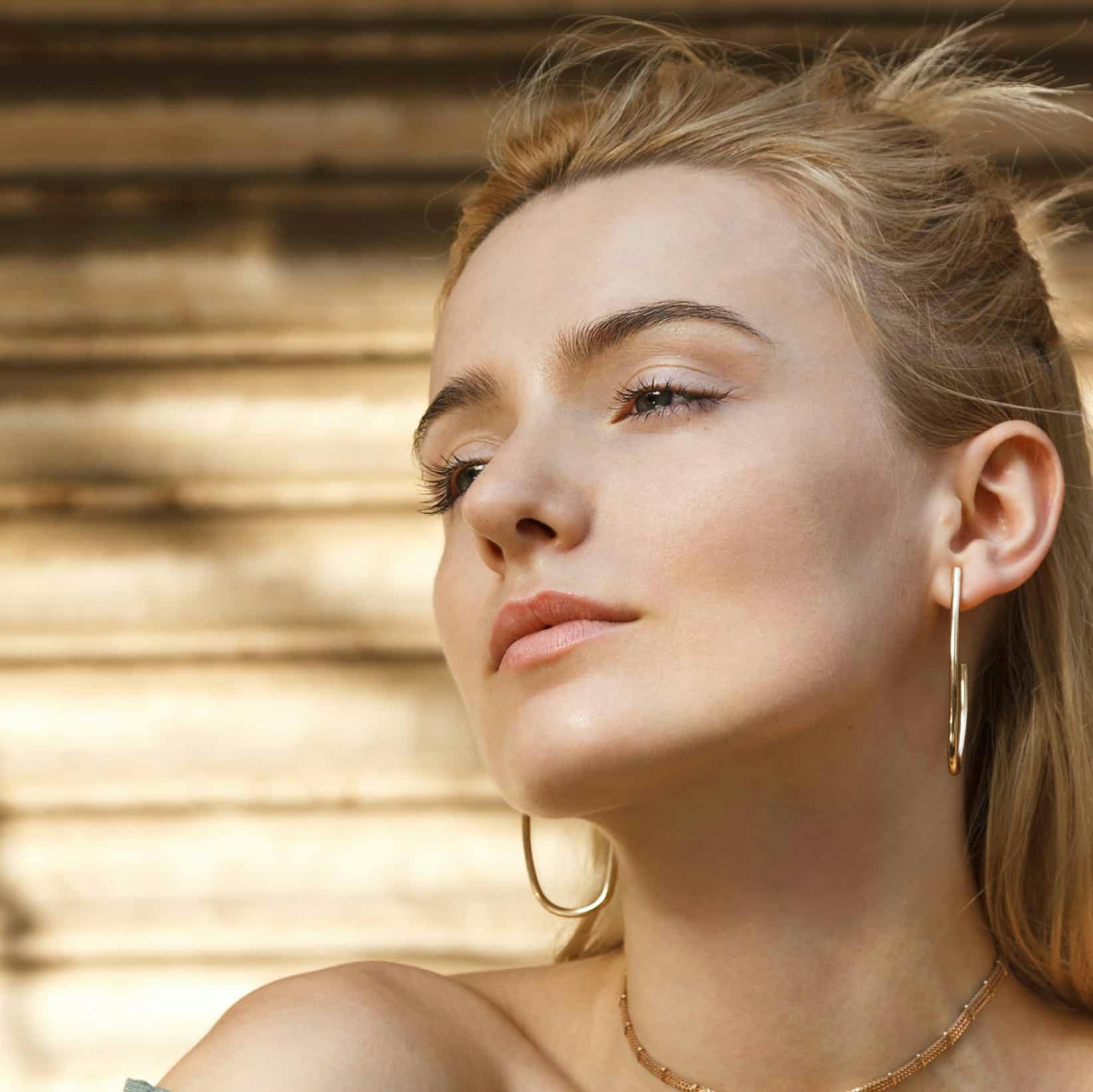 woman with blonde hair and clear skin