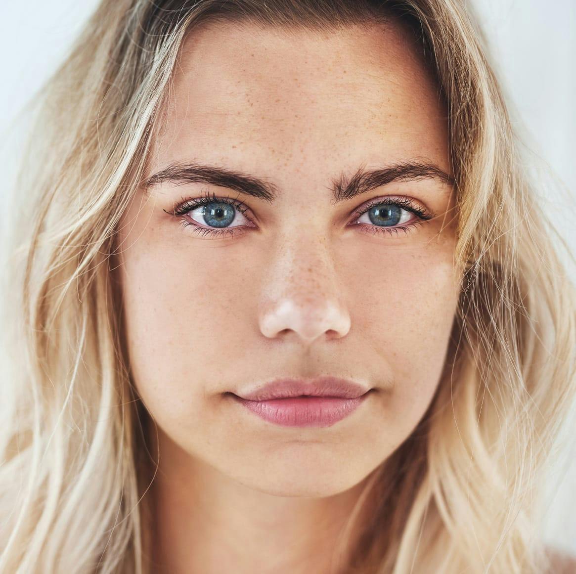woman with blonde hair and freckles