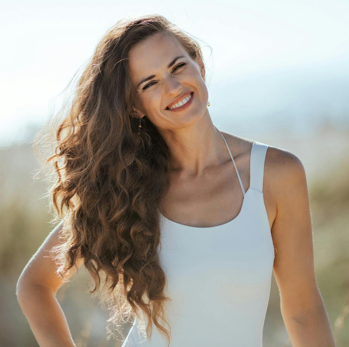 woman with long brown curly hair
