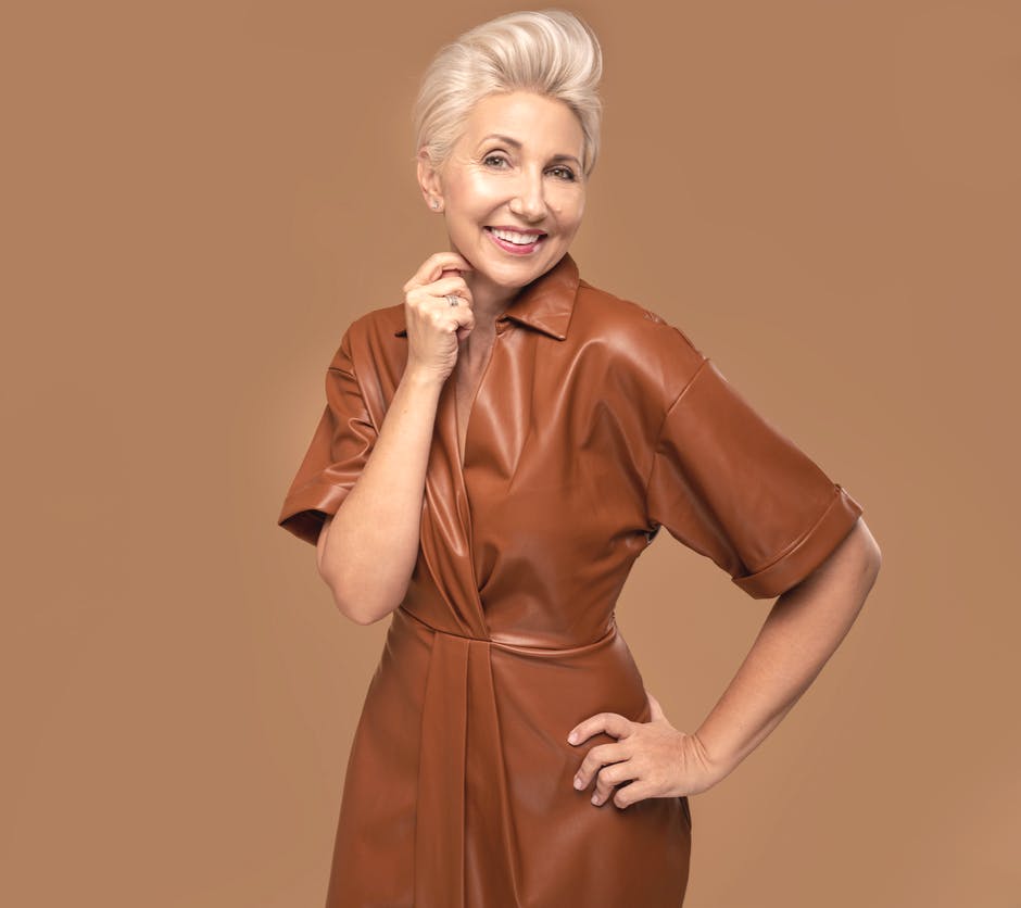 Older yet youthful woman with white hair in fashion studio shoot. Young appearance emulates potential results of a blepharoplasty in McKinney