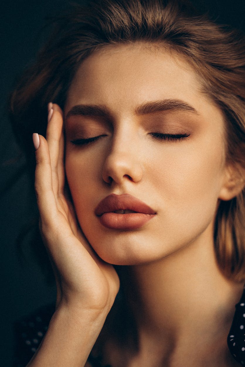 Beautiful woman with hair and makeup done in studio shoot. Her full lips to emphasize the potential results of a lip lift in McKinney