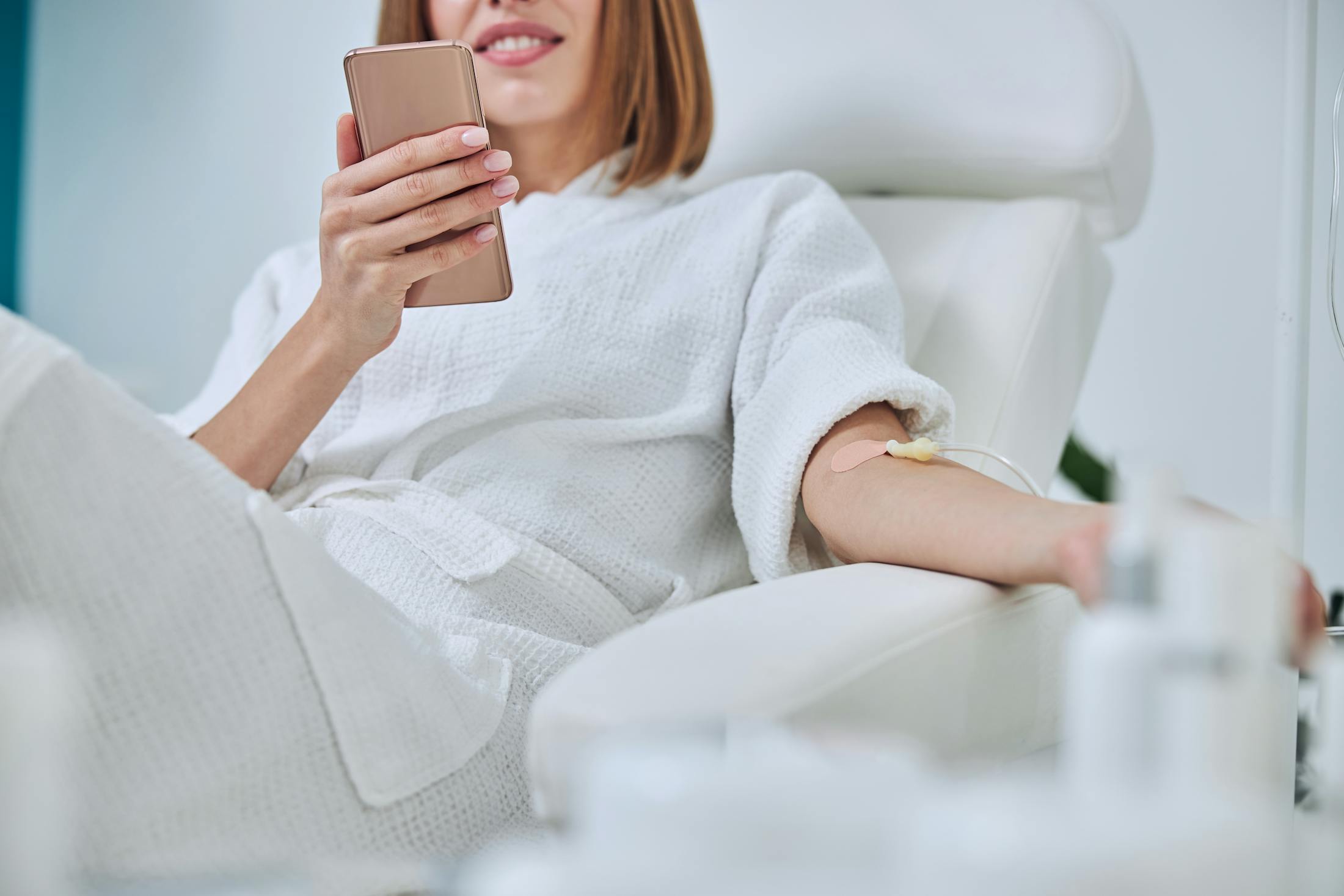 woman in white getting IV Therapy