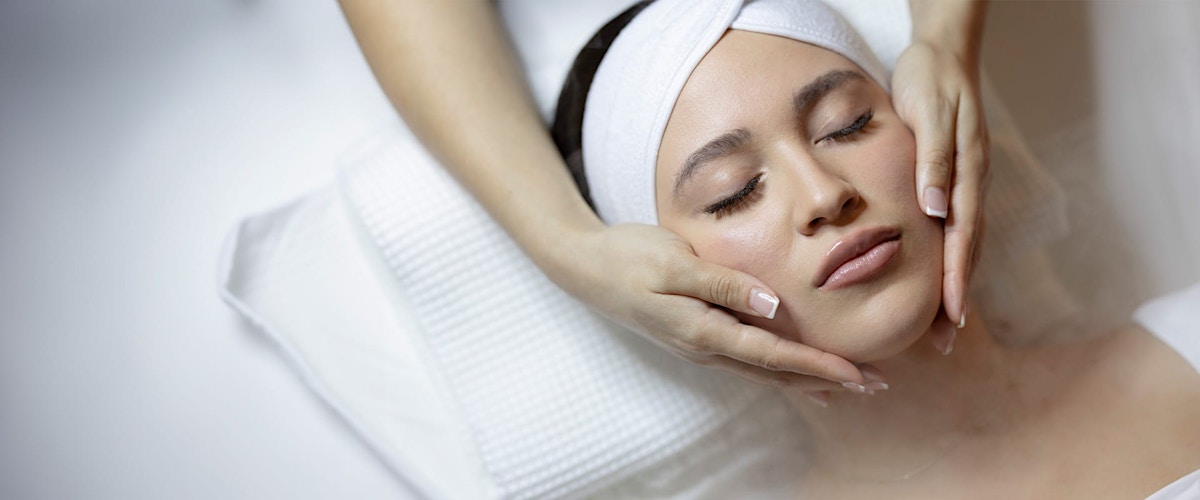 Woman receiving facial