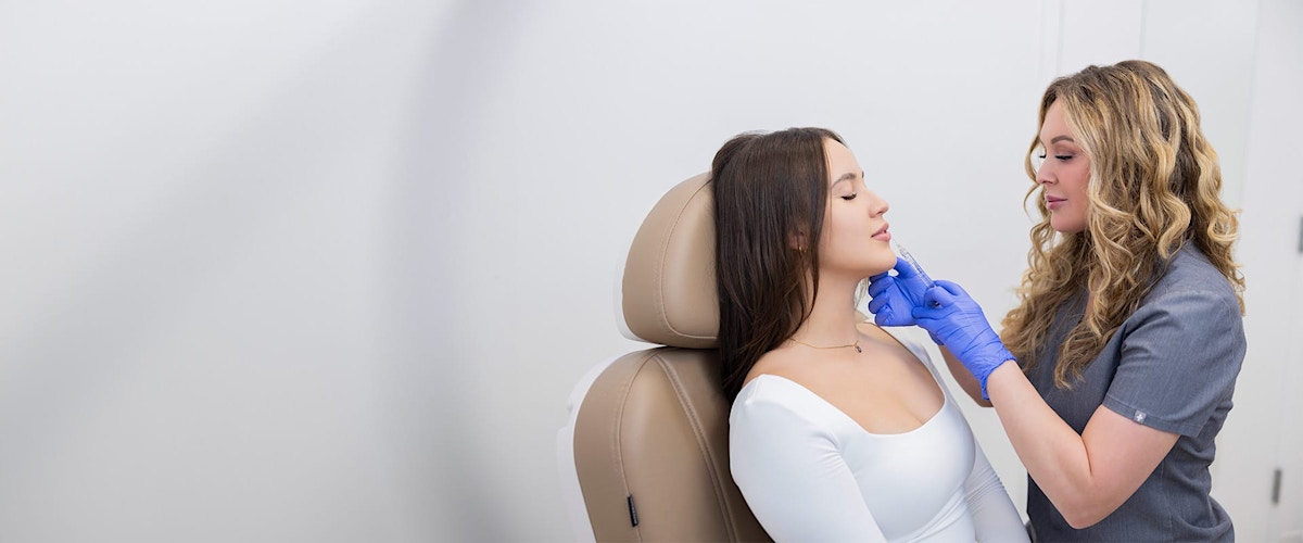 Woman receiving lip injection