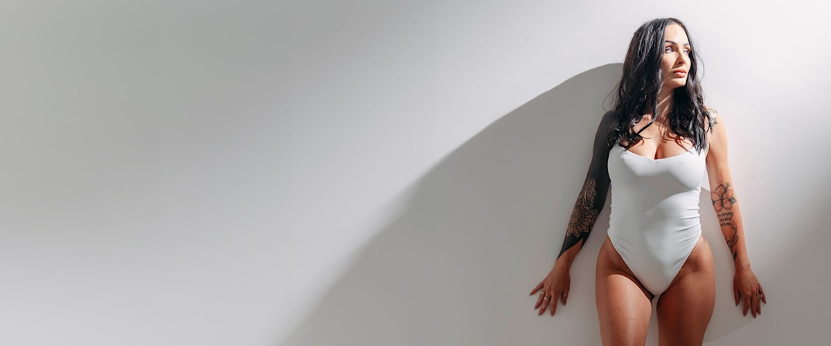 woman in a white bodysuit