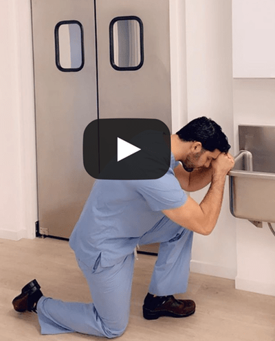 Dr. Oppenheimer kneeling