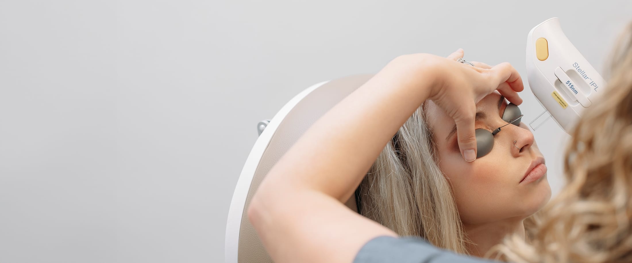 Woman receiving photofacial