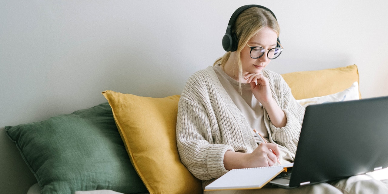 Girl working at home on laptop
