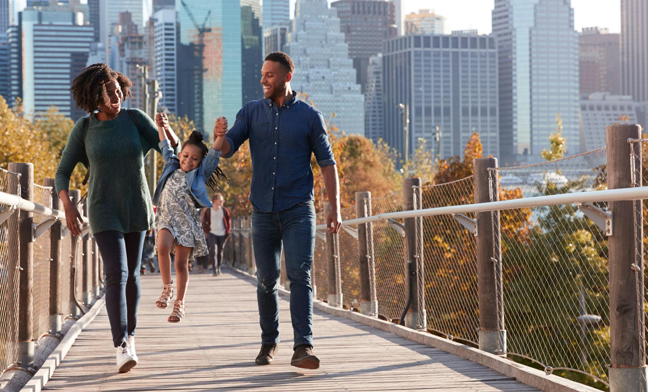 Family walking on a bridge