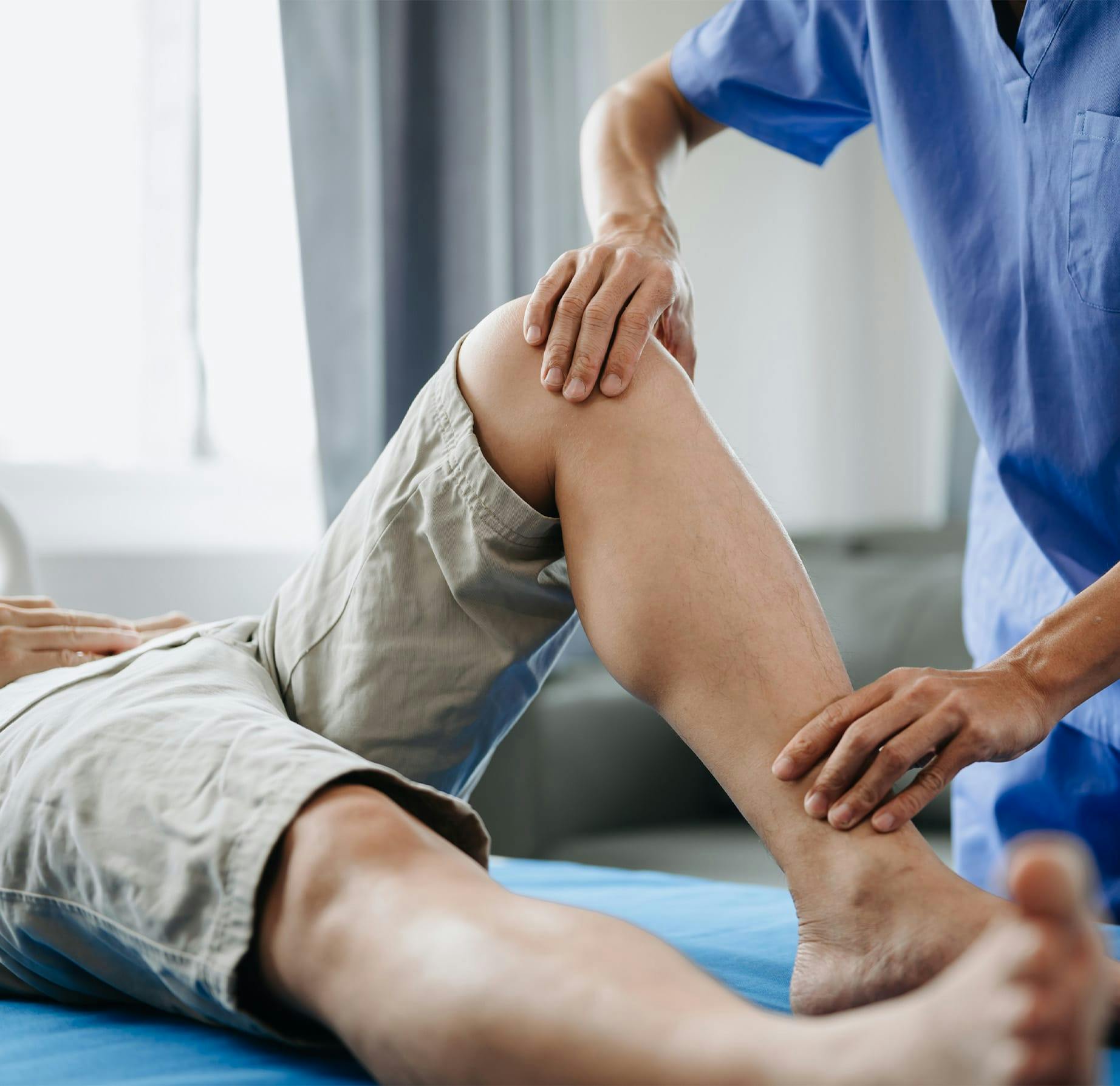 nurse holding patient's leg