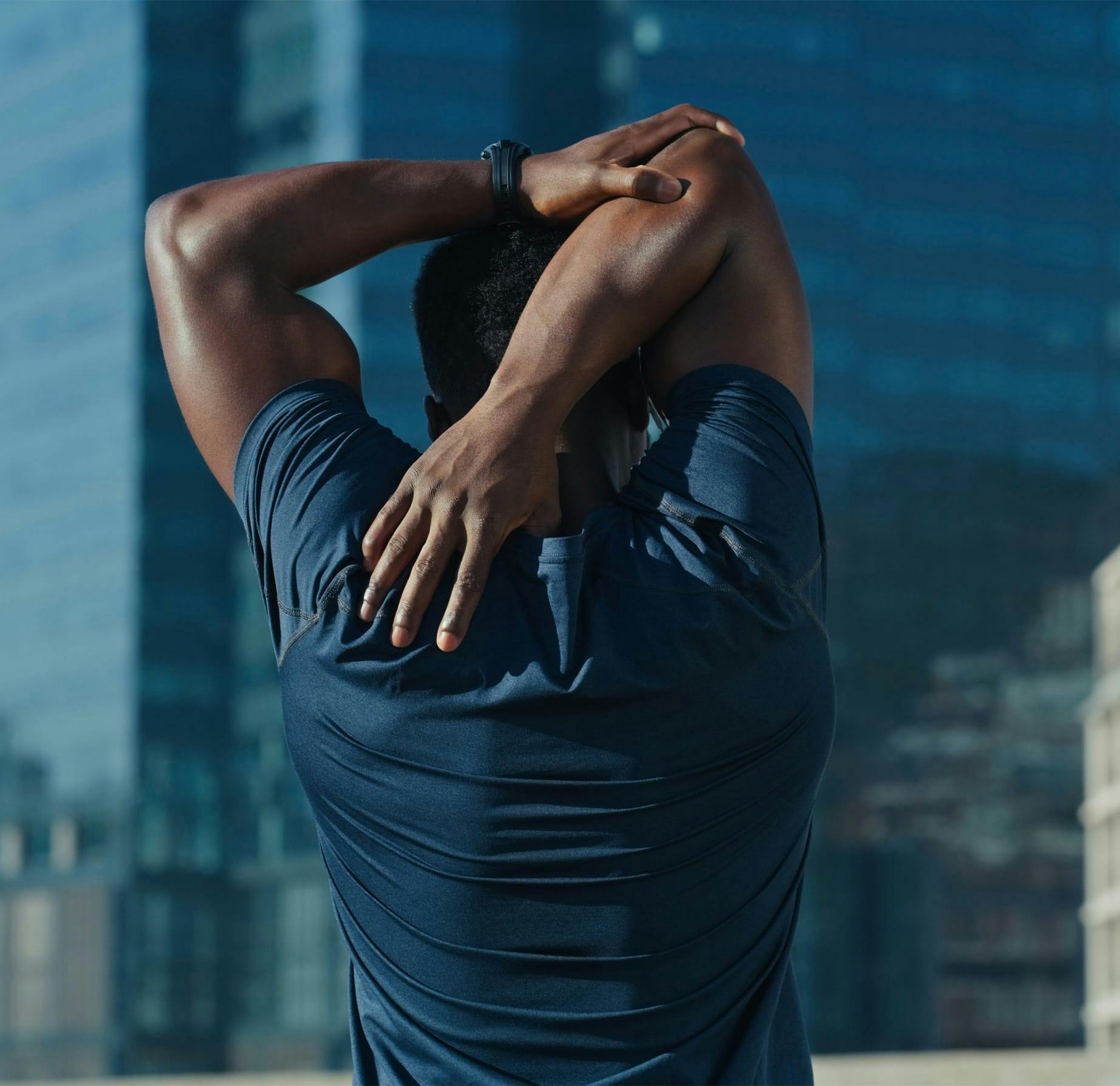 man stretching his arms