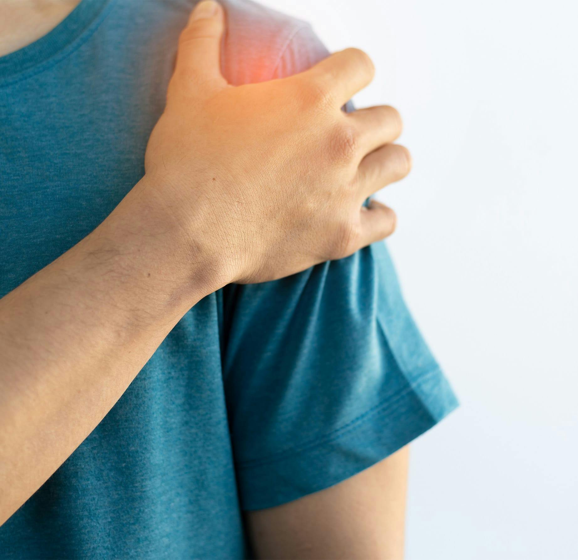 man touching his shoulder