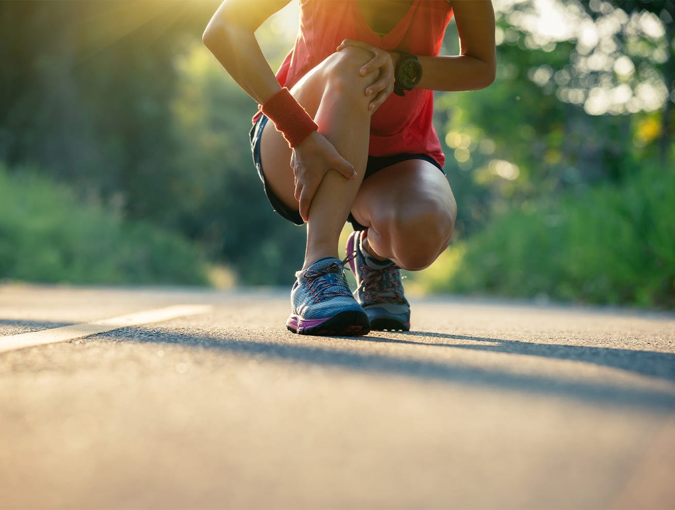 woman on a run, crouching down