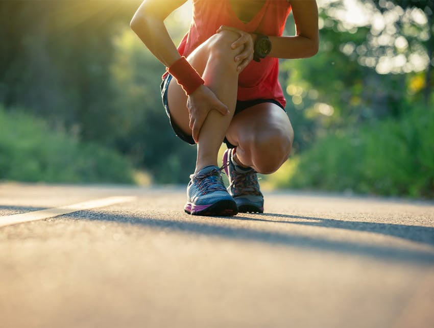 woman on a run, crouching down