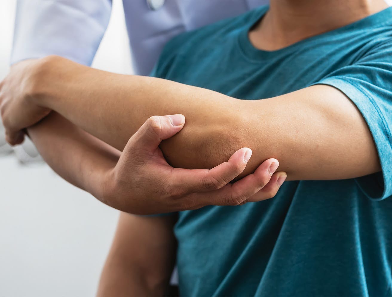 doctor holding a patient's elbow