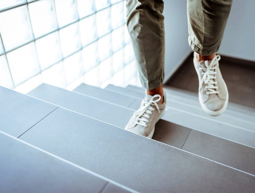 person walking up stairs