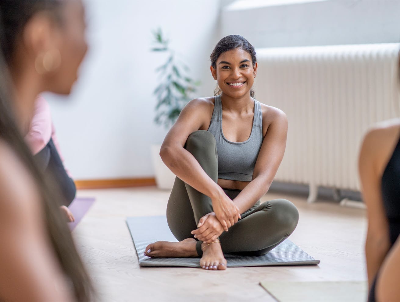 woman sitting in yoga class