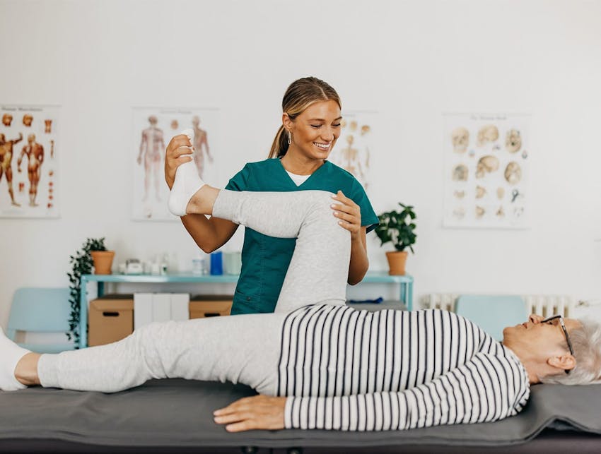 nurse holding patient's leg