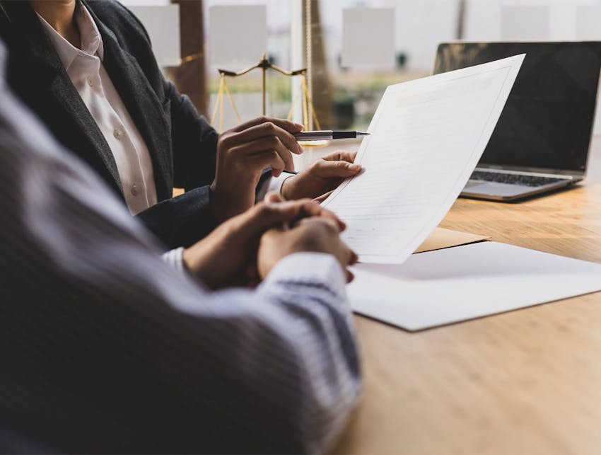 two people going through documents